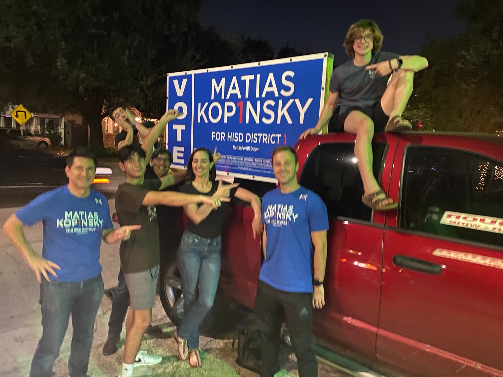 Matias Kopinsky and campaign volunteers on election night, November 2021, beside a truck with a large VOTE Matias Kopinsky for HISD District 1 sign