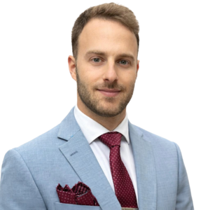 Portrait of Matias Kopinsky in a light blue suit and burgundy tie